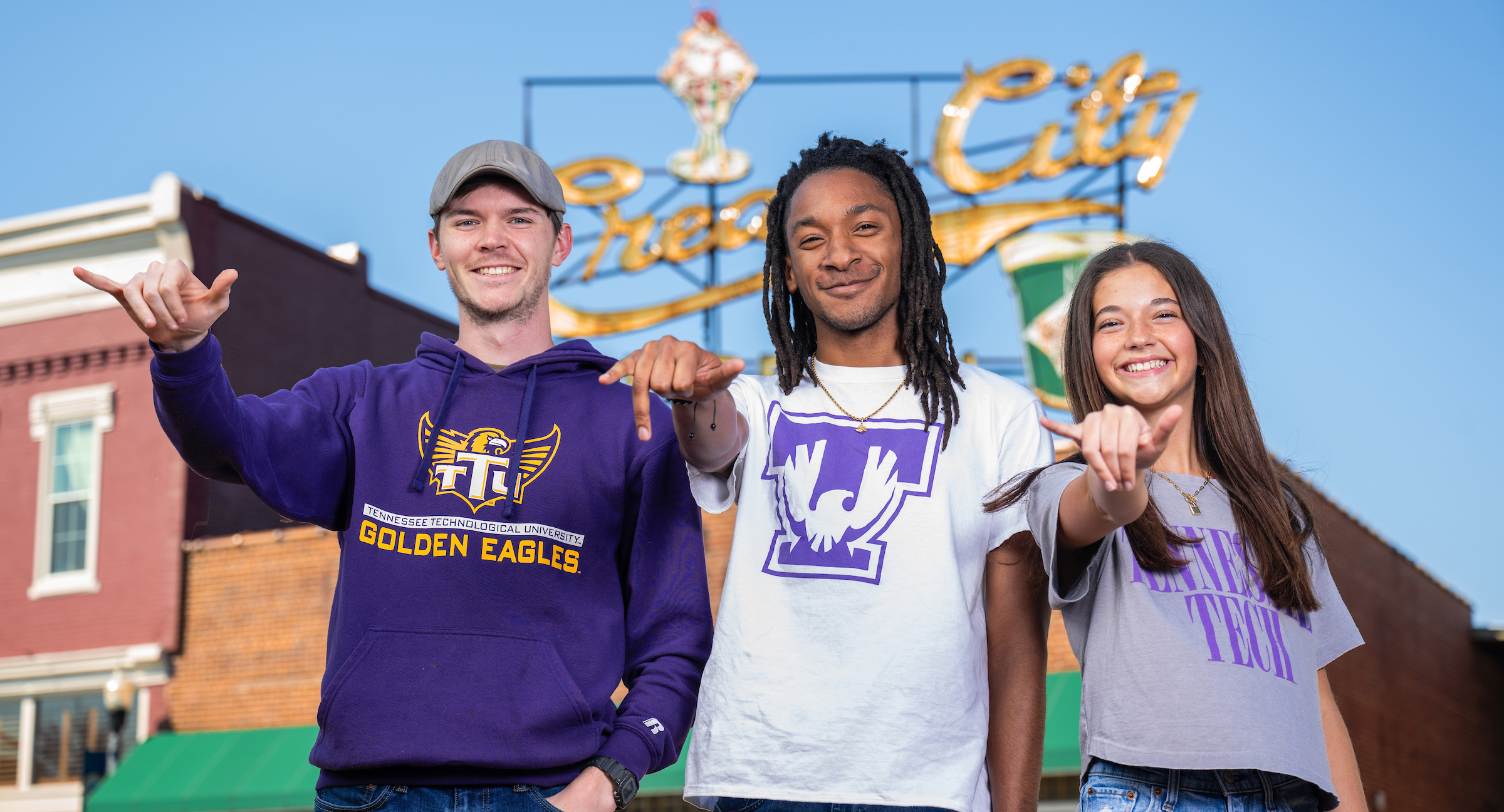 Students showing wings up in front of Cream City