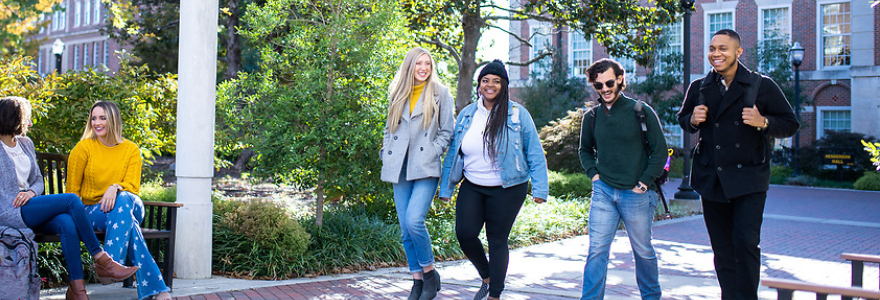 A group of students walking through the Plaza.