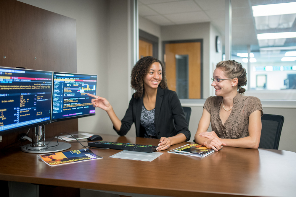 Two students studying business