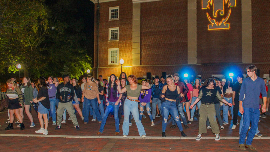 A large group of people dancing on the Plaza.