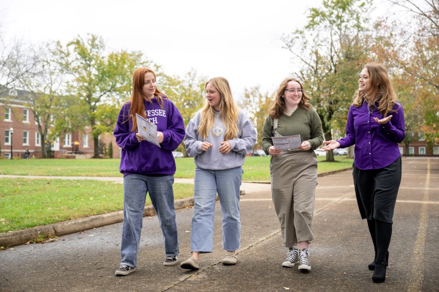 students talking with Scholarship Associate