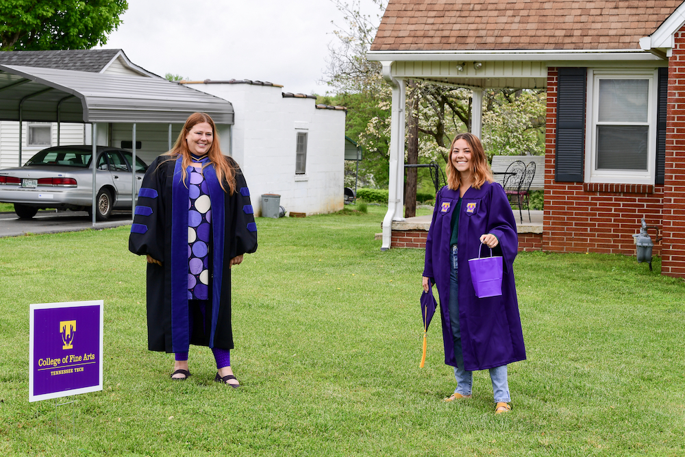 Graduating senior Erin Higgins gets visit and a goodie bag from Jennifer Shank, the dean of the College of Fine Arts.