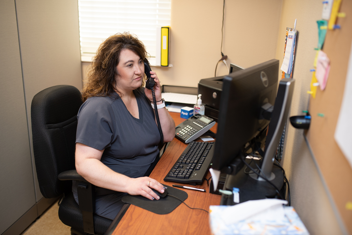 Kim Bowman of Tennessee Tech Health Services takes a report over the phone.