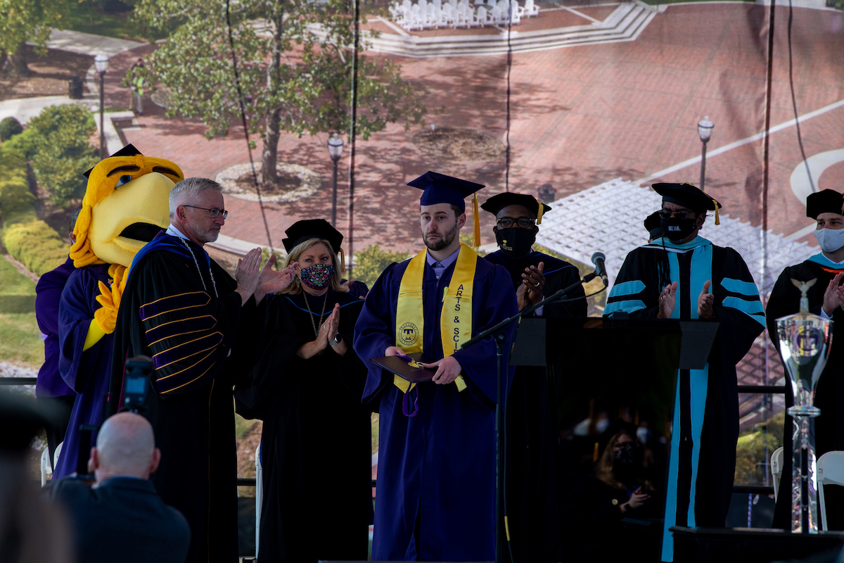 The most heart-felt moment of the morning commencement came when President Oldham recognized Zachary Tyler Parsley. A senior psychology major, who was on track to graduate as an honors student, Zachary was killed in a car crash last Friday. With his family in attendance, Zachary’s brother, Nick, accepted his degree and academic excellence medal to a standing ovation.