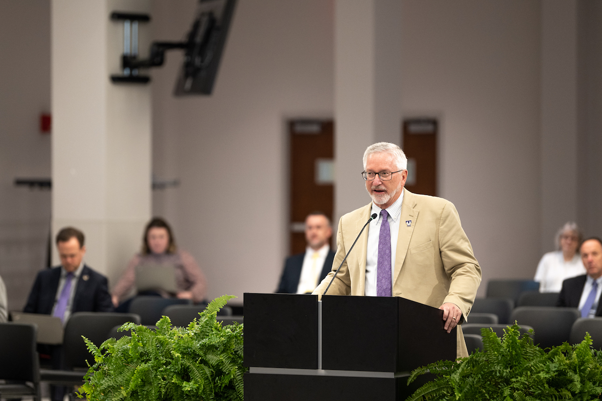 President Oldham delivers his report at the Board of Trustees meeting. 