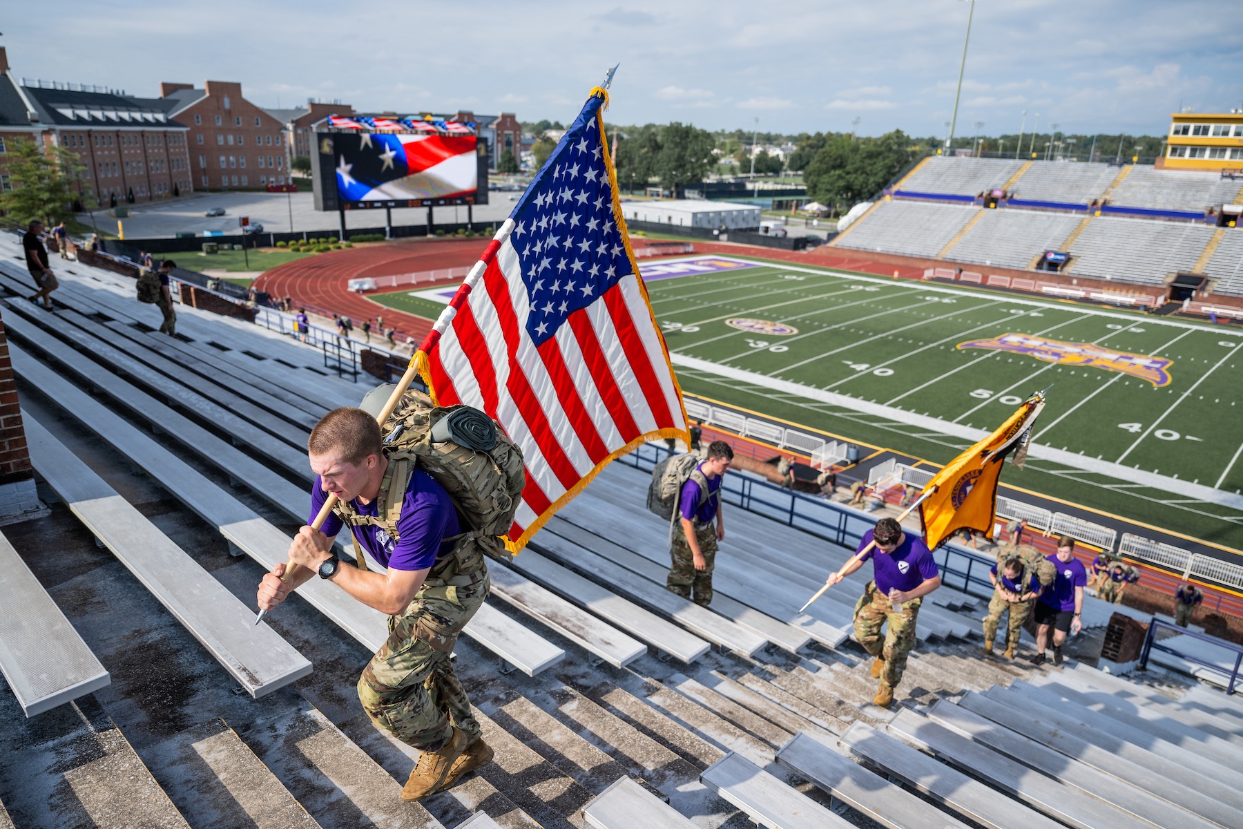 Cadet Samuel Mast, a military science level I student at Tech, carries the American flag at the annual 9/11 memorial stair climb.