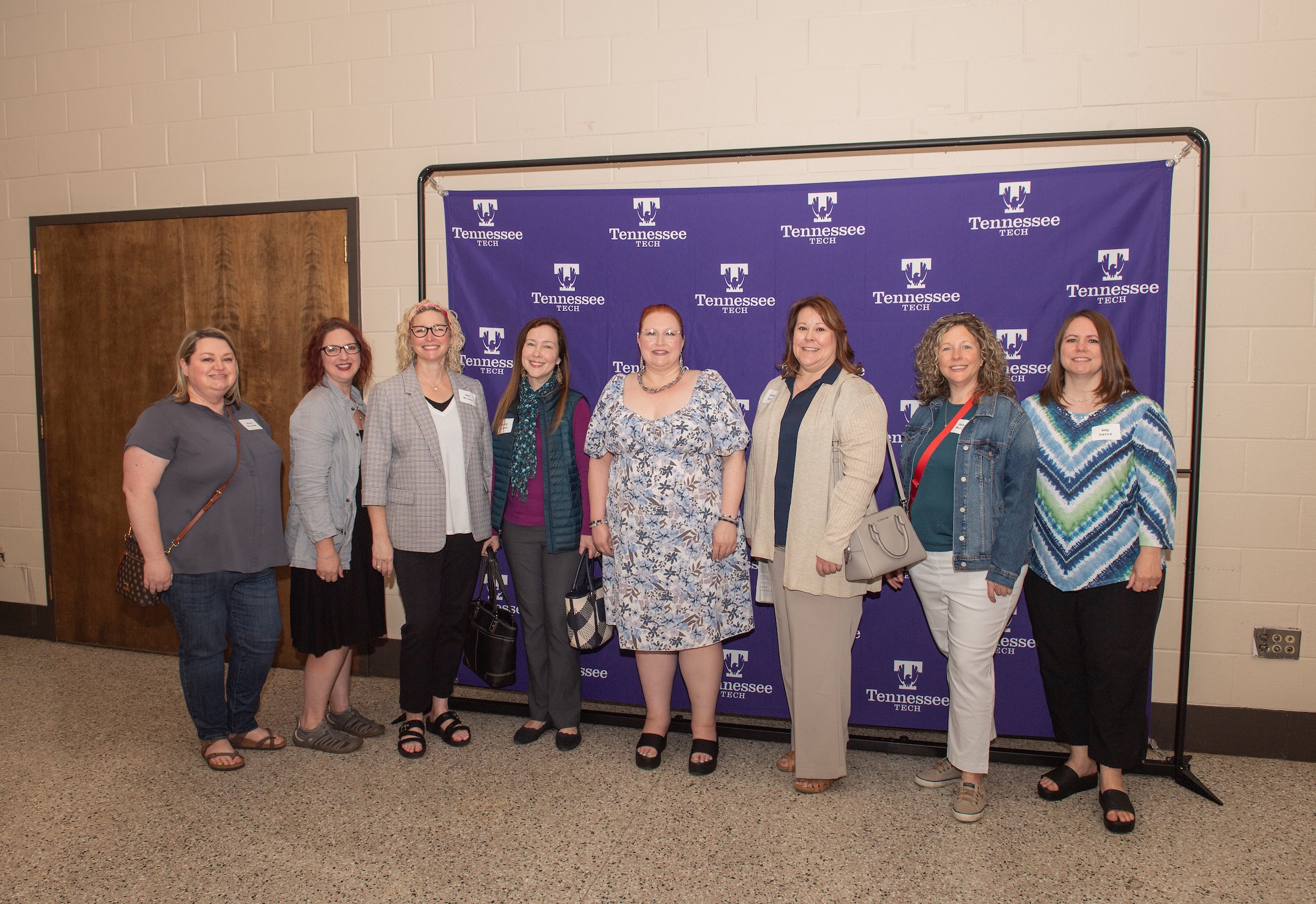 From left: Oracle alumni Anne Grissom, Lindsay Pride, Amy Wilson, Mandy Wilson, Tracey Hackett, Donna Baskin-Enis, Heather Mullinix and Amy Davis.