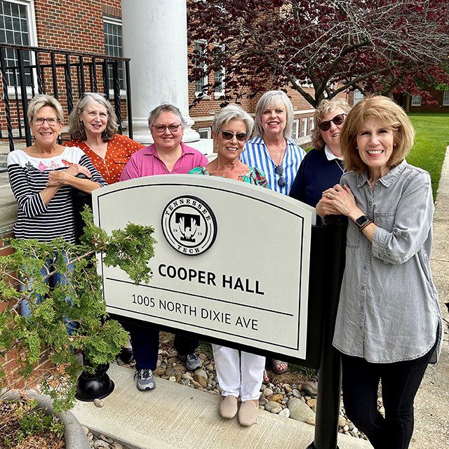 Group photo of Amelia Beard Cohagan, Tammy McCarroll-Burroughs, Laurie King Stone, JoNell O'Connor, Becky Rawls Buckley, Ginny Combs Stevens, Tammy Holt Dillon and Leta Winningham Dalton.