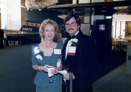 a man and a woman posing together 